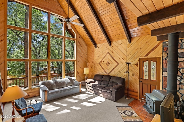 246 E Acorn Ln, Payson, AZ 85541 - living area featuring wood ceiling, a wood stove, ceiling fan, and wood walls