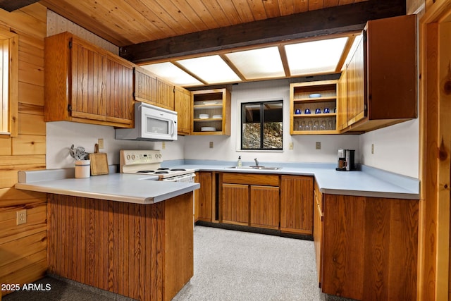 246 E Acorn Ln, Payson, AZ 85541 - kitchen with white appliances, a peninsula, brown cabinets, open shelves, and light countertops