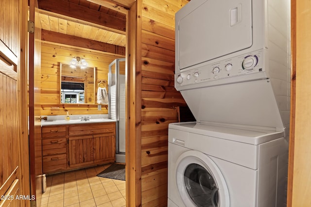 246 E Acorn Ln, Payson, AZ 85541 - laundry room with estacked washer and dryer, wood walls, and light tile patterned floors