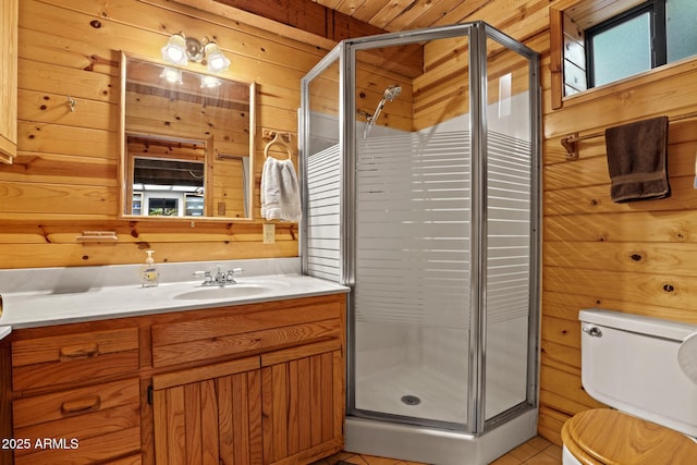 246 E Acorn Ln, Payson, AZ 85541 - bathroom featuring wood walls, vanity, a stall shower, and tile patterned flooring