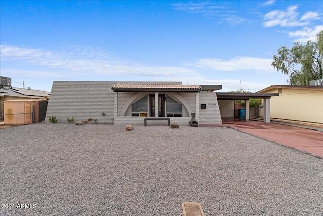 view of front of home with a carport