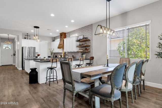 dining area featuring sink and dark hardwood / wood-style flooring