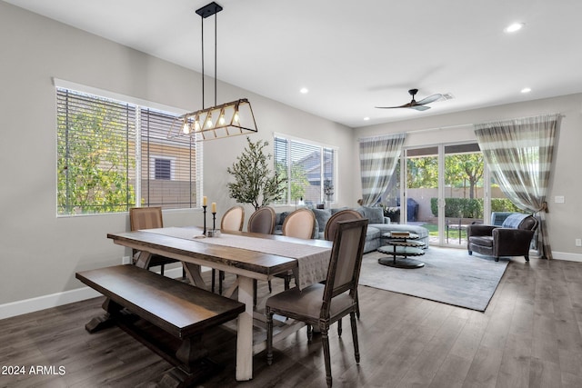 dining space featuring ceiling fan, dark hardwood / wood-style floors, and a healthy amount of sunlight