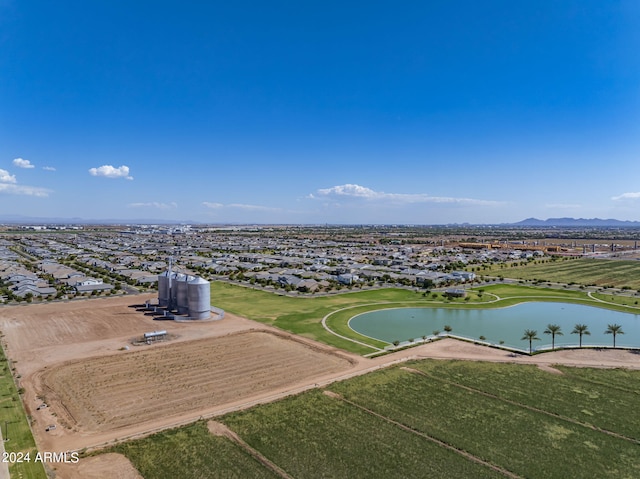 birds eye view of property featuring a water and mountain view