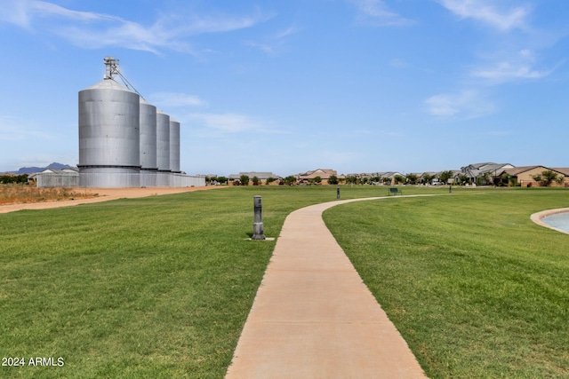 view of property's community featuring a yard