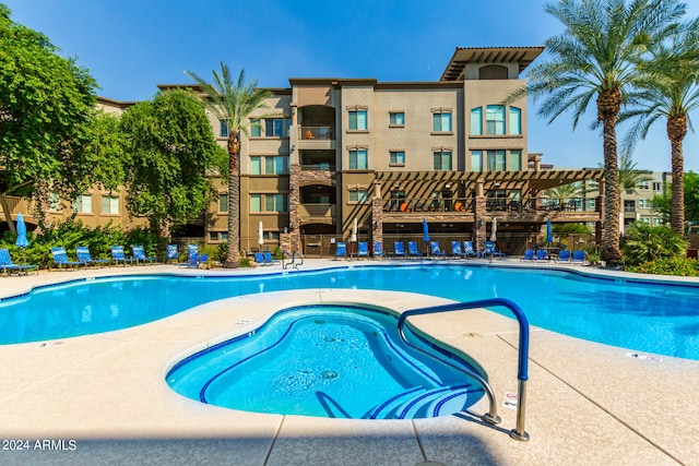 view of pool featuring a community hot tub