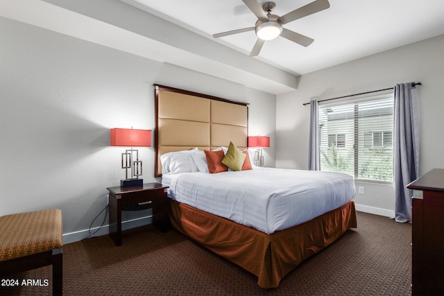 bedroom with dark colored carpet and ceiling fan