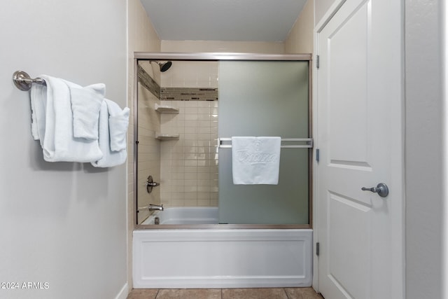 bathroom featuring enclosed tub / shower combo and tile patterned floors