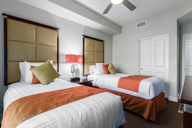 carpeted bedroom featuring ceiling fan