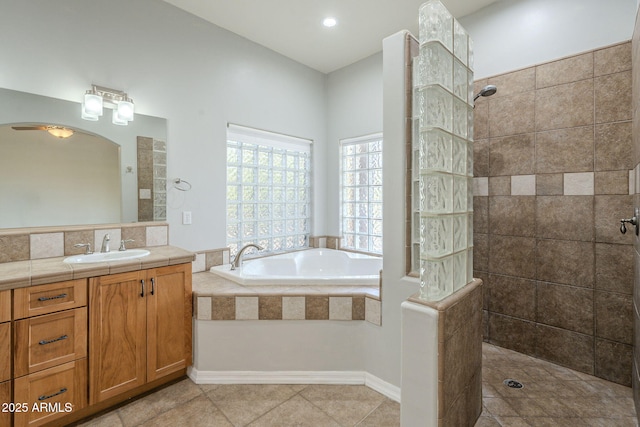 full bathroom with a garden tub, walk in shower, vanity, and tile patterned floors