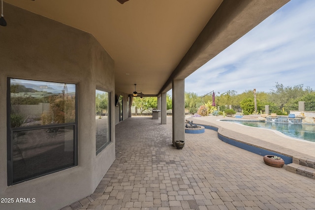 view of patio with a fenced in pool
