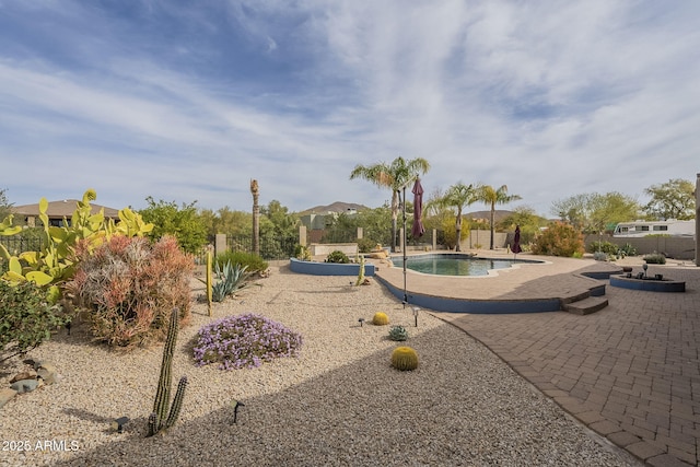 exterior space with a patio and fence
