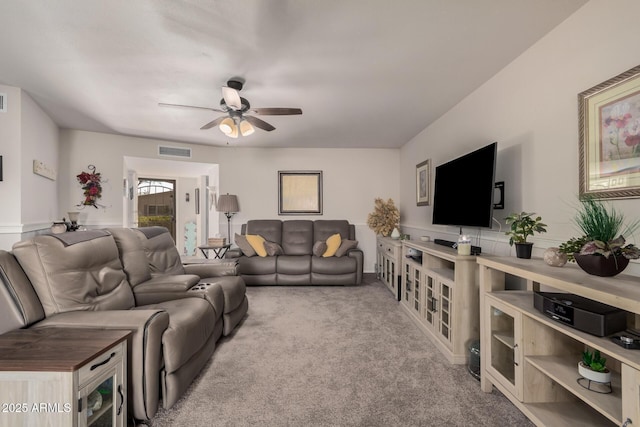 living room featuring ceiling fan and light carpet