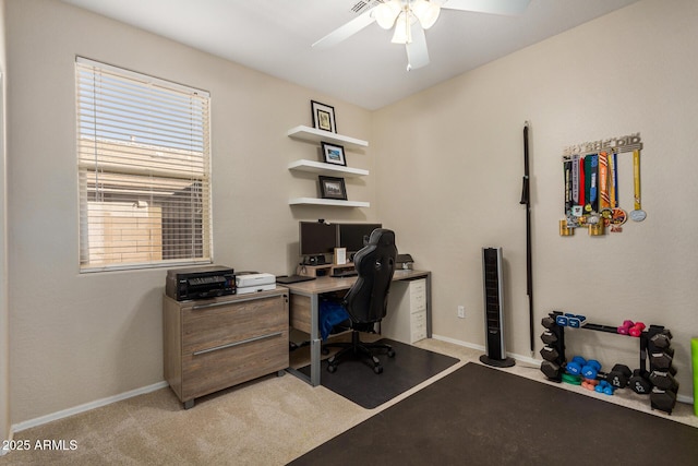 office with light carpet and ceiling fan