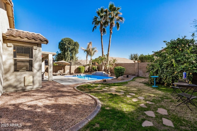 view of yard featuring a patio area and a fenced in pool