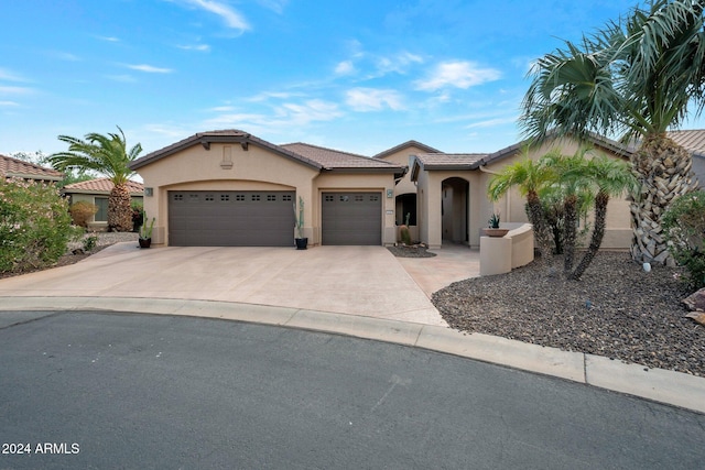 view of front of home with a garage