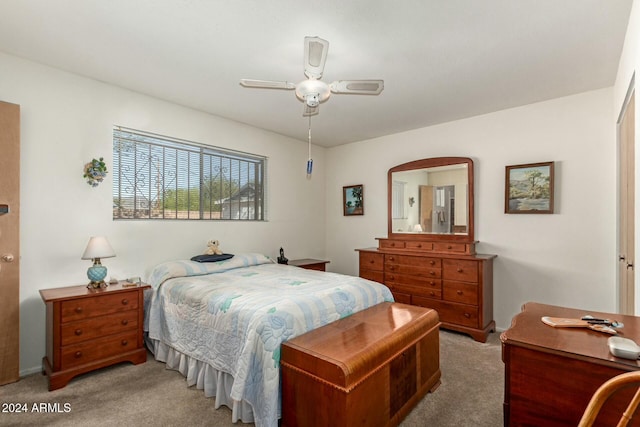 carpeted bedroom with a closet and ceiling fan