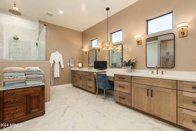 bathroom featuring vanity and a shower with door