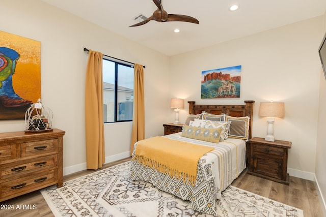 bedroom featuring light hardwood / wood-style flooring and ceiling fan