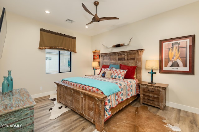 bedroom with ceiling fan and light wood-type flooring