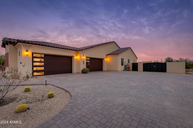 mediterranean / spanish-style home featuring a garage