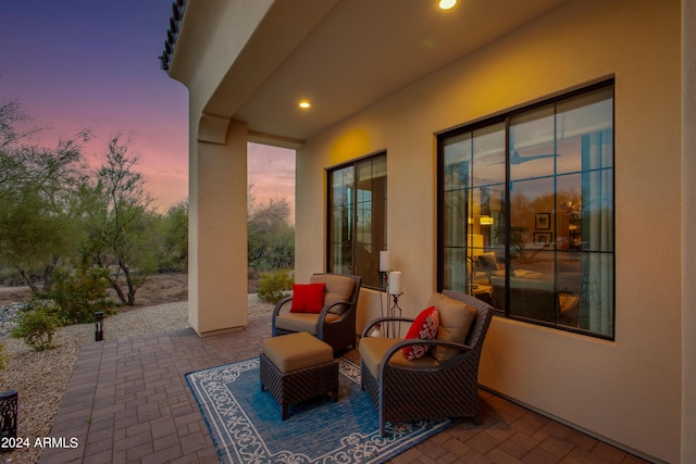 view of patio terrace at dusk