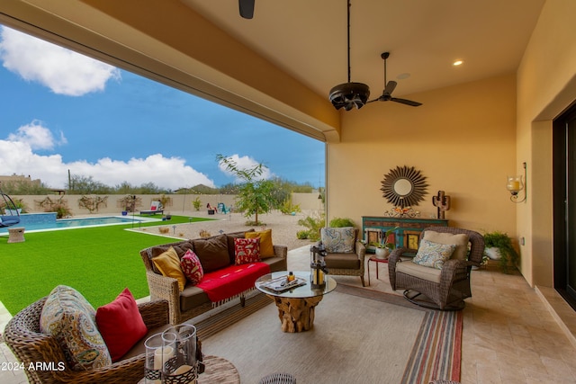 view of patio featuring ceiling fan, an outdoor hangout area, and a fenced in pool