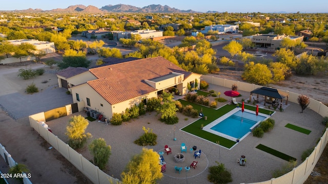 birds eye view of property featuring a mountain view