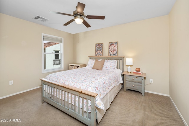 bedroom featuring ceiling fan, baseboards, visible vents, and light carpet