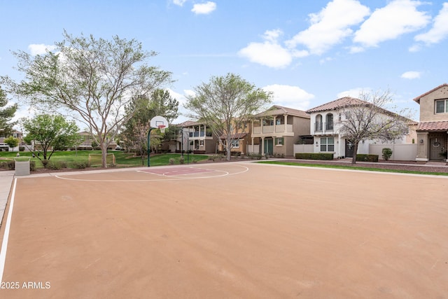 view of basketball court with a residential view and community basketball court