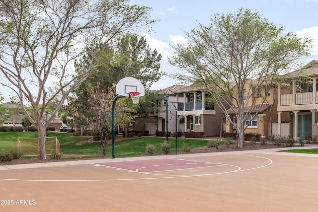 view of sport court with a yard and community basketball court