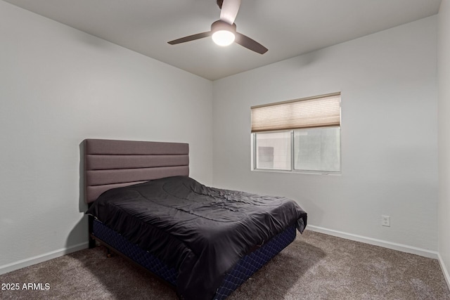 carpeted bedroom featuring a ceiling fan and baseboards