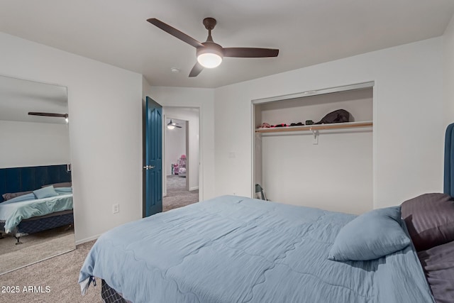 bedroom featuring baseboards, carpet, a ceiling fan, and a closet