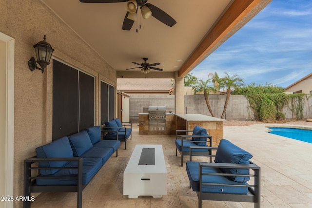 view of patio / terrace with ceiling fan, an outdoor kitchen, a fenced backyard, an outdoor hangout area, and area for grilling