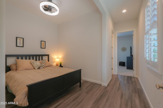 bedroom featuring recessed lighting, wood finished floors, and baseboards