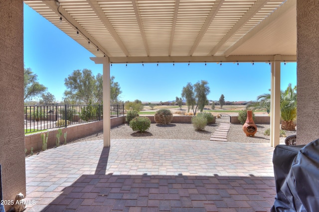 view of patio / terrace with fence, a grill, and a pergola