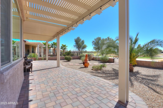 view of patio / terrace with a fenced backyard and a pergola