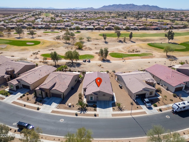 aerial view with a residential view, a mountain view, and golf course view