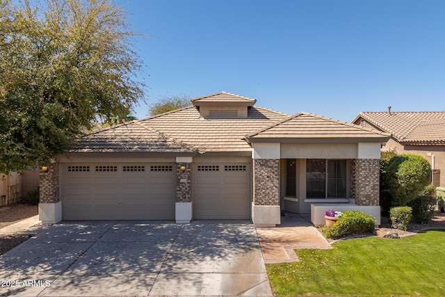 view of front of property with stucco siding, an attached garage, and concrete driveway