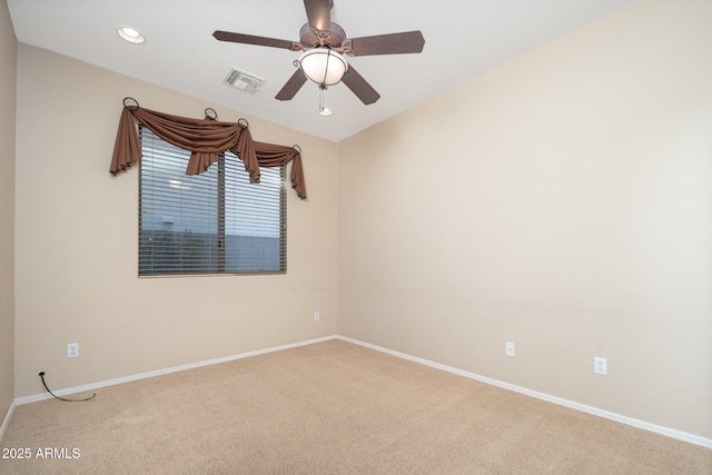 carpeted spare room with a ceiling fan, recessed lighting, baseboards, and visible vents