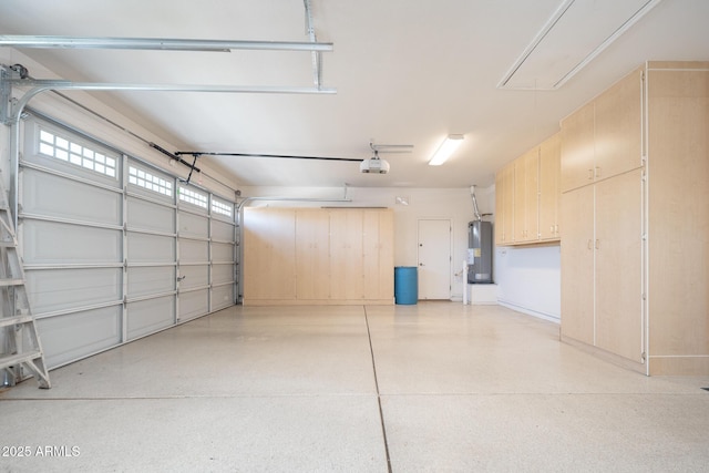 garage with a garage door opener and water heater