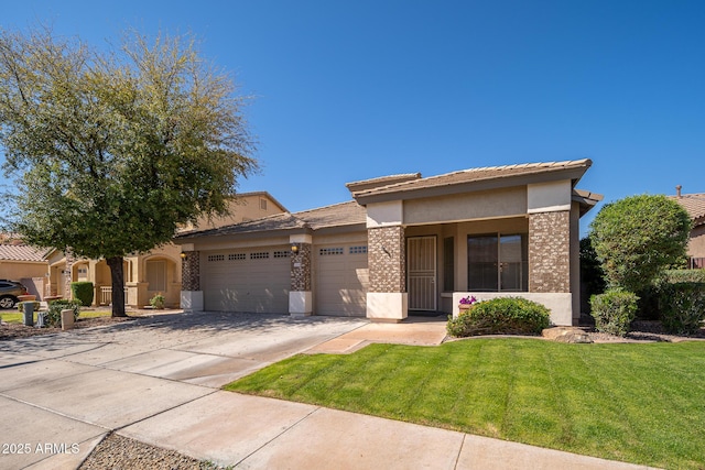 view of front facade with brick siding, a front yard, stucco siding, a garage, and driveway