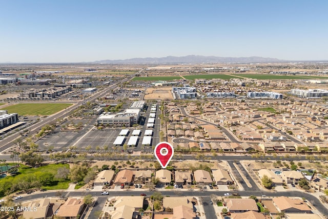 birds eye view of property with a mountain view