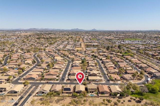 drone / aerial view featuring a residential view and a mountain view