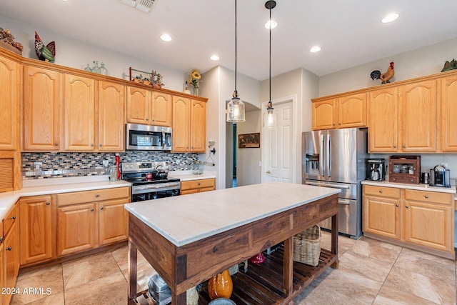 kitchen with appliances with stainless steel finishes, decorative backsplash, and decorative light fixtures