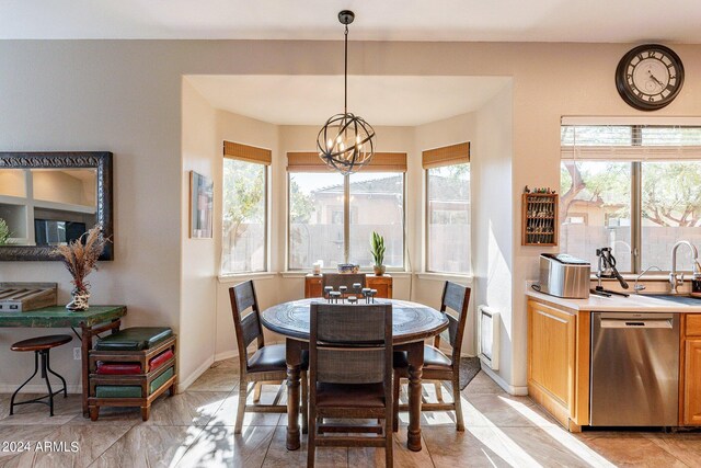 dining area with a notable chandelier and a wealth of natural light