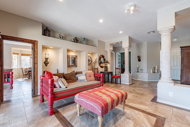 living room featuring decorative columns