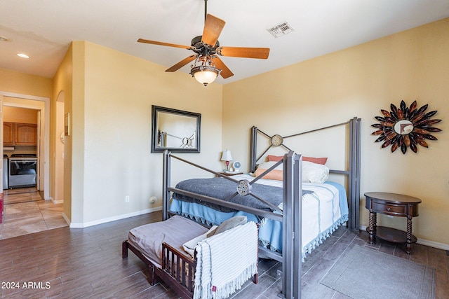 bedroom with ceiling fan and dark wood-type flooring