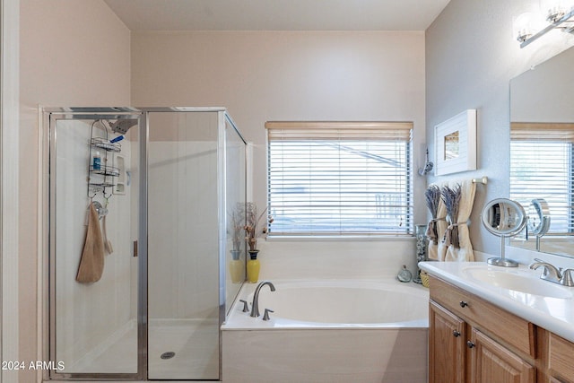 bathroom featuring vanity and separate shower and tub