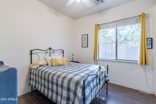 bedroom featuring ceiling fan and dark hardwood / wood-style floors